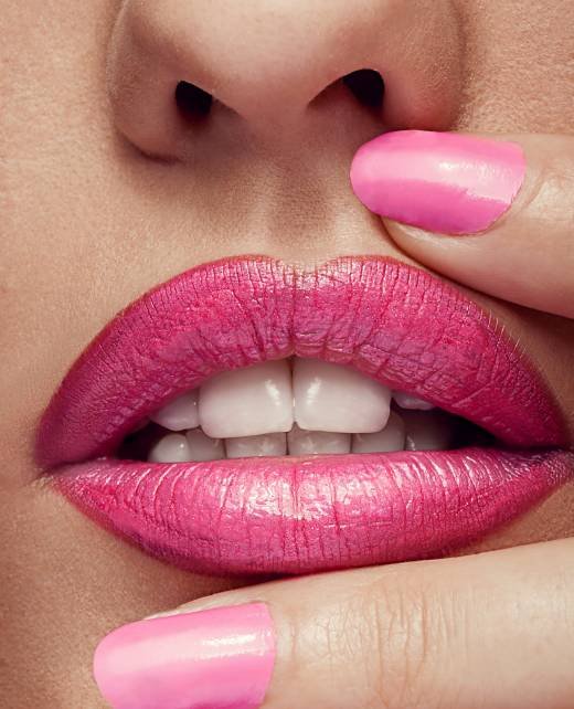 Close up pink lips and nails Close up lips and nails with professional make up. Pink color
